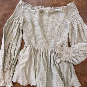 Off the shoulder shirt by glam.